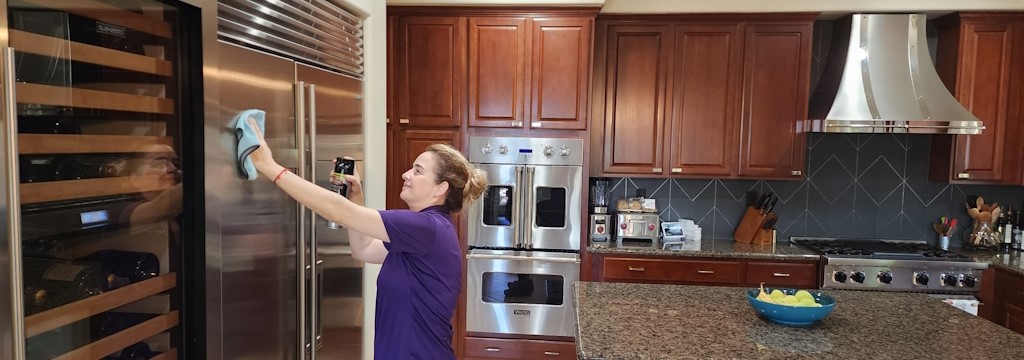 A picture of our staff cleaning the kitchen